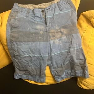 Shorts with bleach stains.
